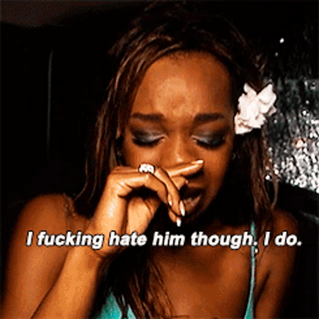 a woman crying with the words i fucking hate him though i do