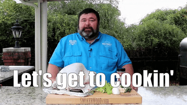 a man in a blue shirt with the words let 's get to cookin ' on the bottom