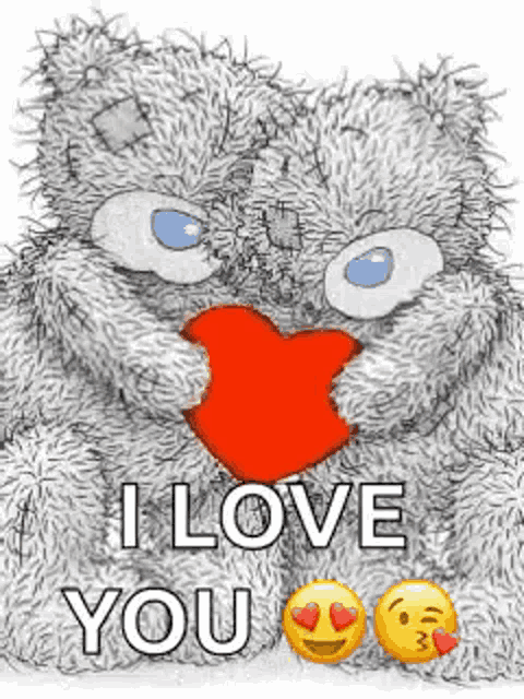 a teddy bear is holding a red heart in its paws and saying `` i love you '' .