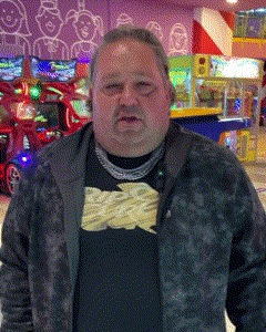 a man wearing a black shirt that says french fries