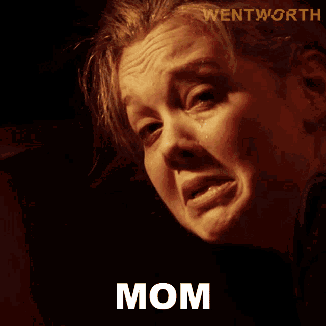 a woman with tears running down her face and the word mom written below her