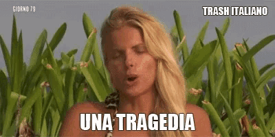 a woman in a bikini is standing in front of a field of plants and says una tragedia .