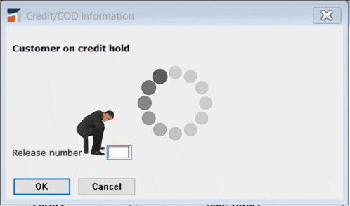 a computer screen shows a man talking on a cell phone and the words customer on credit hold below him