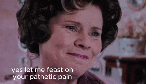 a close up of a woman 's face with the words yes let me feast on your pathetic pain below her