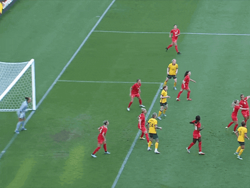 a soccer player wearing the number 16 jumps to catch the ball