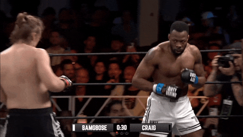 a boxing match between bambose and craig is being shown on a screen