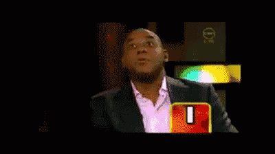 a man in a suit says " definitely " in front of a 0