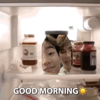 a fridge with a jar with a man 's face in it and the words good morning