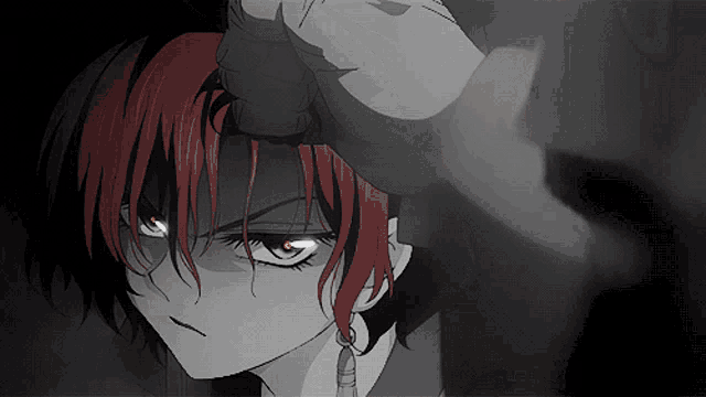 a close up of a girl with red hair and red eyes