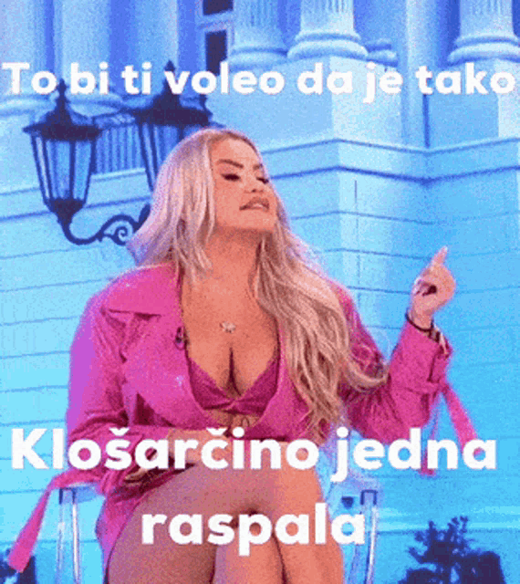 a woman in a pink jacket is sitting in front of a building with the words to bi ti voleo da je tak klosarcino jedna raspala