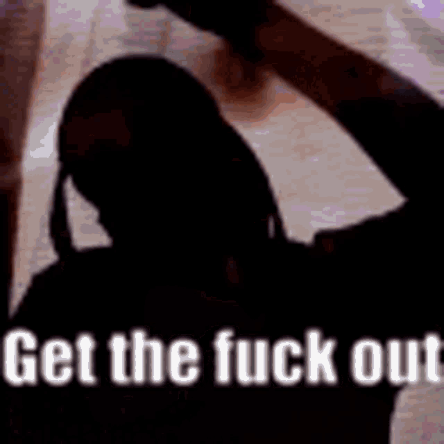a silhouette of a man holding a gun with the words `` get the fuck out '' written above him .
