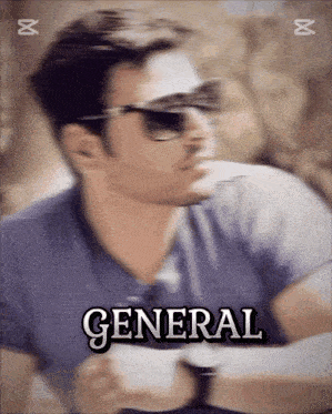 a blurry picture of a man wearing sunglasses with the word general on the bottom