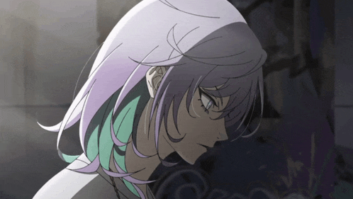 a girl with purple and green hair is looking down