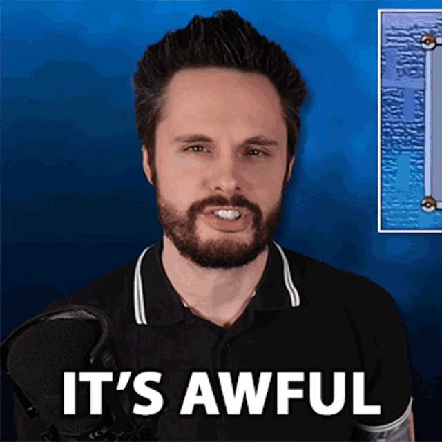 a man with a beard says it 's awful in front of a blue background