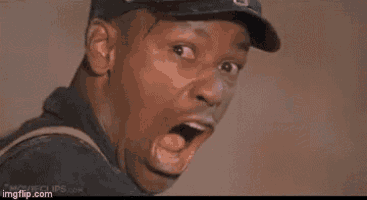 a man in a baseball cap is making a funny face .