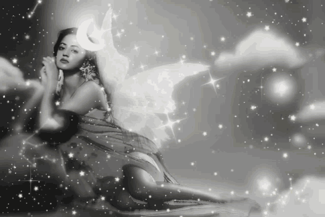 a woman in a fairy costume is surrounded by stars