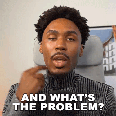 a man is sitting in a chair and says and what 's the problem .