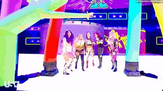a group of women are standing next to each other on a stage in a cartoon .