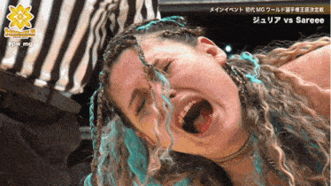 a woman with braids and blue hair is crying in front of a referee and the words sareee on the bottom