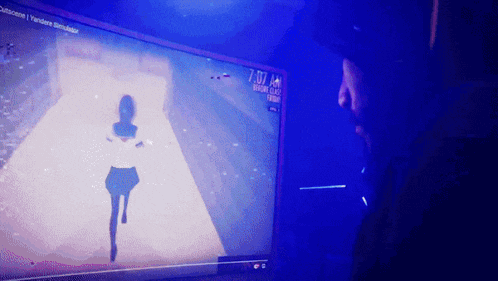 a man watches a video on a computer screen that says 7:07 am