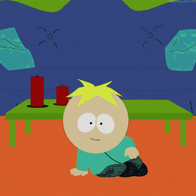 a cartoon character named butters from south park sits on the floor
