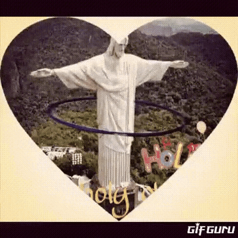 a statue of jesus with a hula hoop around his waist in a heart shaped frame