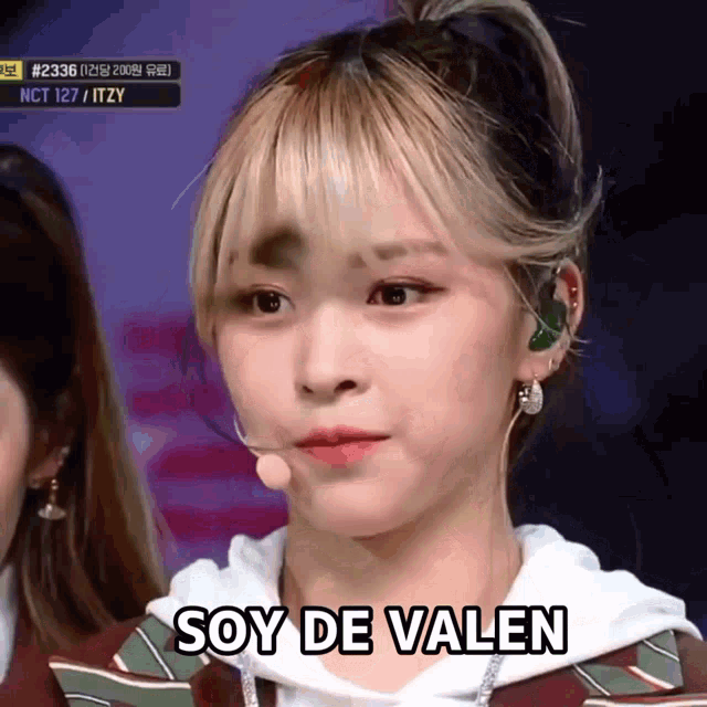 a close up of a girl with the words soy de valen written on her face