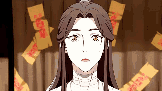 a woman in a white dress is surrounded by yellow papers with chinese characters on them