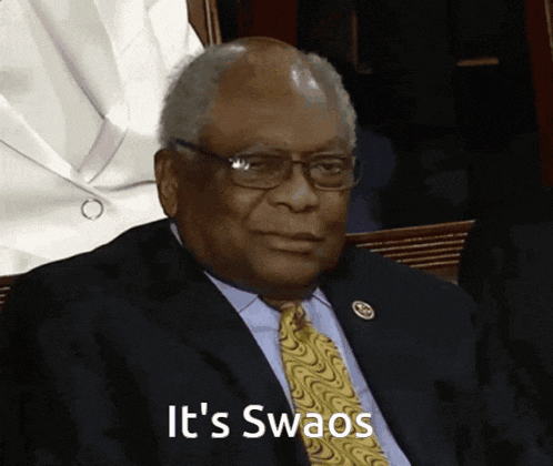 a man in a suit and tie with the words it 's swaos written below him