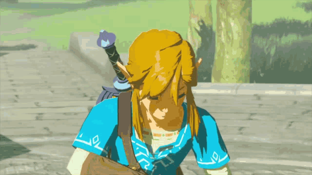 a video game character with a blue shirt and a blue sword