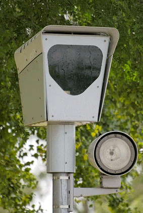 a traffic light with a heart shaped window on the top