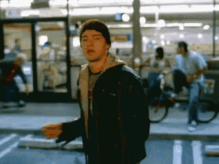 a blurry picture of a man in a black jacket and beanie