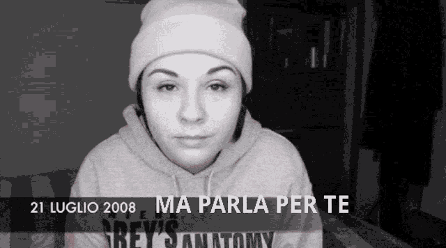 a woman wearing a beanie and a grey 's anatomy sweatshirt