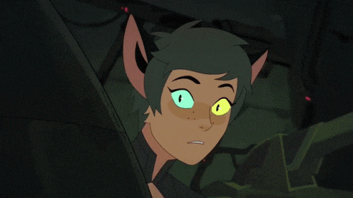 a close up of a cartoon character 's face with green eyes