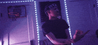 a man wearing a headband that says rebel on it