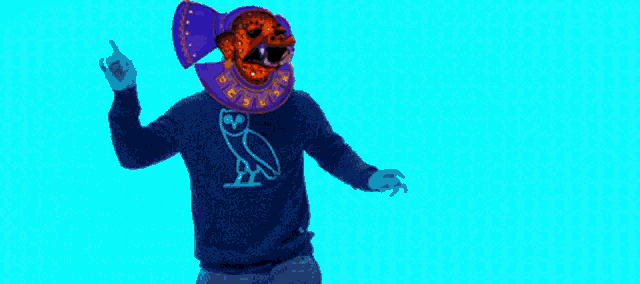 a silhouette of a person wearing a colorful mask with a zodiac sign around their neck