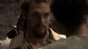 a man with dreadlocks is talking to another man who says i remember .