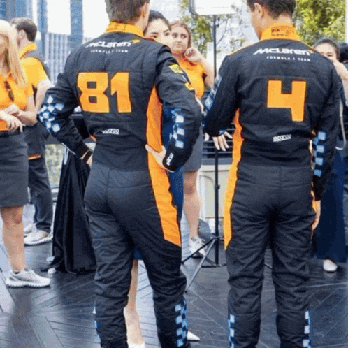 a man in a mclaren uniform has the number 4 on the back of his shirt