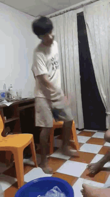 a man wearing a shirt that says ' i love you ' on it is jumping in the air