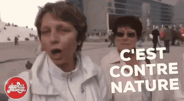 two women standing next to each other with the words c'est contre nature behind them