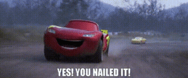 lightning mcqueen from the movie cars is smiling and driving down a dirt road .
