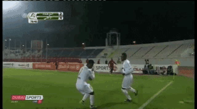 a soccer game is being played on a tv screen