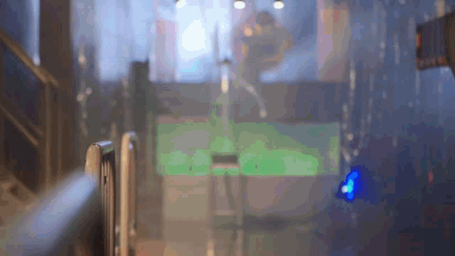 a blurred image of a person standing in the rain