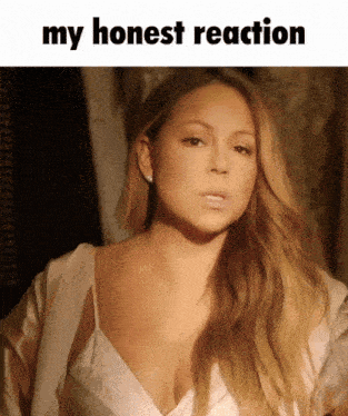 a picture of mariah carey with a caption that says " my honest reaction "