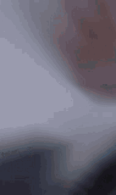 a pixel art drawing of a person 's face with a dark background
