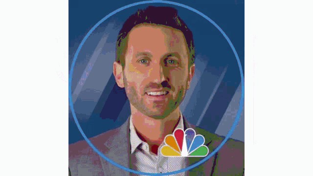 a man in a suit is smiling in a nbc logo circle