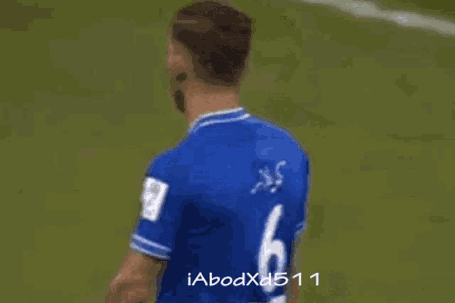 a man in a blue jersey with the number 6 on it