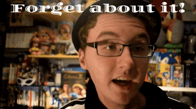 a man wearing glasses and a hat with the words forget about it above him