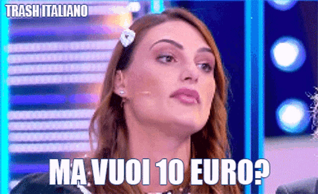 a woman with a flower in her hair says ma vuoi 10 euro ?