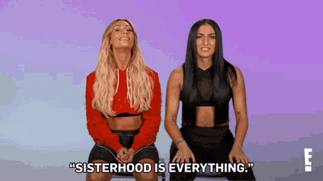 two women sitting next to each other with the words " sisterhood is everything " on the screen